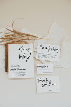 the wedding stationery was handwritten with black ink and were placed on top of each other