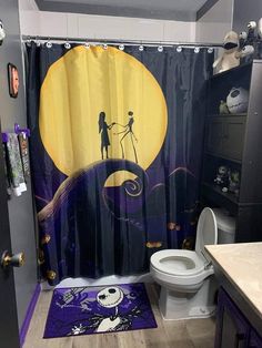 a bathroom with a halloween themed shower curtain