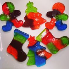 several gummy bears are arranged in the shape of christmas stocking trees on a plate