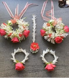 flowers and ribbons are laid out on the ground to be used as wedding bouquets