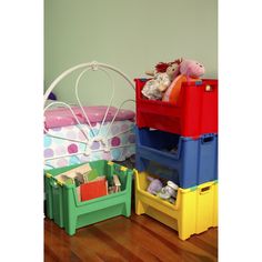 there are many storage bins on the floor next to each other with stuffed animals in them