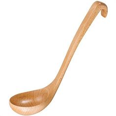 a wooden spoon sitting on top of a white surface