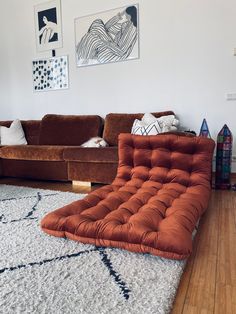 a living room with two couches and a large rug on the floor in front of it