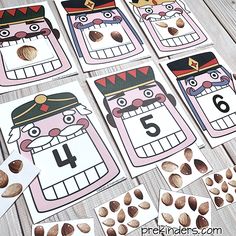 printable numbers for nutcrackers are displayed on a wooden table with nuts