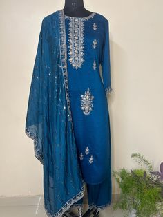 Silk Blend Navy Blue Embroidered Straight Kurta With Trousers and Dupatta Indian Wedding Wear Salwar Kameez / Indian Wedding Dress / Plus Size Cotton Kurta Dress Traditional Indian Wear / Salwar Kameez Dupatta / Kurti Palazzo Set The set contains: 1 Straight Kurta 1 Trousers 1 Dupatta Kurta: The navy blue straight Kurta has a round neck design with sequinned work details in front. The Kurta measures till calf length and has straight hemline. Sleeve length :  3/4 Sleeves Sharara :  Solid trousers Blue Embroidered Bollywood Palazzo Set, Bollywood Style Blue Embroidered Palazzo Set, Festive Blue Palazzo Set With Zari Work, Blue Bollywood Embroidered Palazzo Set, Traditional Blue Palazzo Set For Festive Occasions, Traditional Blue Palazzo Set For Festive Season, Blue Embroidered Palazzo Set For Festivals, Blue Zari Work Palazzo Set For Diwali, Diwali Blue Palazzo Set With Zari Work