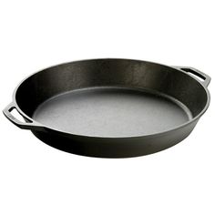 an empty cast iron skillet on a white background