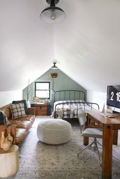 a living room filled with furniture and a flat screen tv