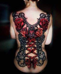 the back of a woman's body with roses and laces on her chest