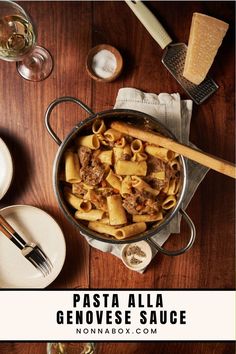 pasta alla genovee sauce in a skillet on a wooden table