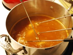 a pot with some liquid in it on the stove