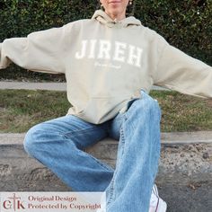 This varsity font Jireh You Are Enough sweatshirt is the perfect gift this Christmas season.  Like our other Jehovah Jireh sweatshirts, this Christian hoodie claims that HE is enough!  Our Jesus hoodie for men and women pairs perfectly with fall flannel shirts wrapped around the waste or as an oversized sweatshirt with leggings.  Our vibey aesthetic clothes are great birthday gifts for her, a trendy Christmas gift for mom, an awesome best friend gift, or a gift for you!  For the oversized hoodie look, we recommend sizing up 1-2 sizes from your typical size. Use code BUNDLE30 at checkout for 30% off orders of 3 or more items + FREE SHIPPING on domestic orders $35 and above! * S I Z I N G * These are unisex hooded sweatshirts.  Therefore, the fit is comparable to standard men's sizing.  For Vibey Aesthetic, Sweatshirt With Leggings, Jehovah Jireh, Trendy Christmas Gifts, Varsity Font, Positive Clothes, Fall Flannel