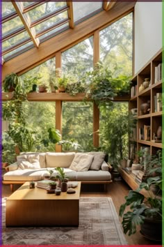 a living room filled with furniture and lots of plants