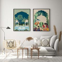 two paintings hang on the wall above a couch in a room with white walls and flooring