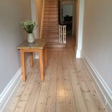 the hallway is clean and ready to be used as a place for someone to sit