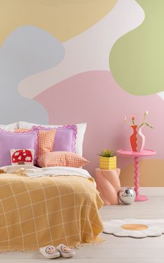 a bedroom with colorful walls and furniture