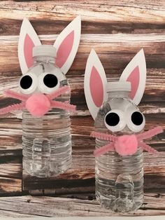 two mason jars decorated with bunny ears and pink bows