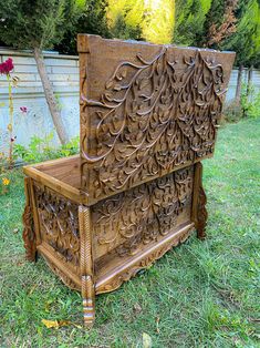 an old wooden bench sitting in the grass