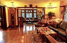 a living room filled with furniture and wooden floors