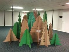 cardboard christmas trees in an office cubicle