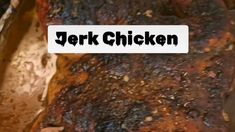 the words jerk chicken are written on a piece of meat that has been grilled