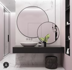 a bathroom with two round mirrors on the wall and a sink in front of it