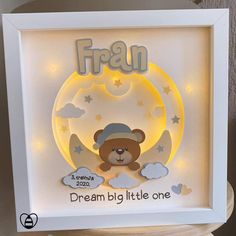 a light up frame with a teddy bear on it