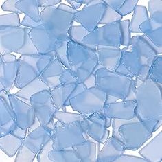 small blue glass pieces on a white background