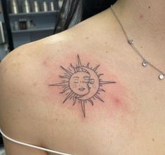 a woman with a sun and moon tattoo on her shoulder