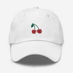 Elevate your style with the 2 Cherries Embroidered Hat, a delightful fusion of design and comfort. 🍒🍒 🧵 Product Details: * Material: Crafted from 100% cotton twill, ensuring a soft and comfortable feel. * Design: Showcases two charming cherry embroideries, adding a touch of sweetness to your everyday look. * Style: Features an unstructured, 6-panel, low-profile design for a relaxed and casual appearance. * Ventilation: Designed with 6 embroidered eyelets to provide proper airflow, keeping you Cute Hats With Embroidered Logo And Curved Brim, Trendy Embroidered Cap, Cute Red Snapback Baseball Cap, Trendy White Embroidered Hat, Red Embroidered Snapback Hat, Trendy Red Cotton Hat, Red Embroidered Baseball Cap With Curved Brim, Trendy Visor Hat With Embroidered Logo, Trendy Embroidered Snapback Baseball Cap