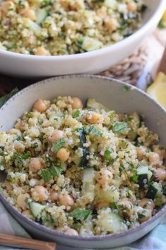 two bowls filled with food on top of a table