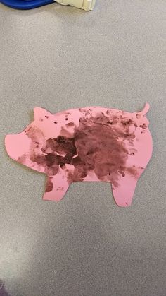 a piece of paper that has been cut out to look like a pig on the table