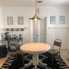 a white table and chairs in a room