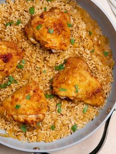 chicken and rice in a pan on a table