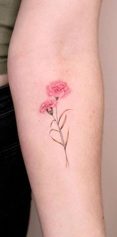 a small pink flower on the right thigh