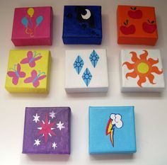 six different colored boxes with designs on them