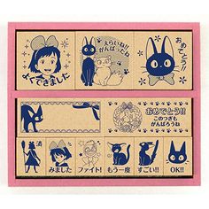 two wooden stamps with japanese characters and cats on them, one in blue and the other in pink