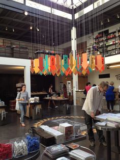 the people are looking at items on display in the store's open floor plan