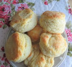 several biscuits on a plate with pink flowers