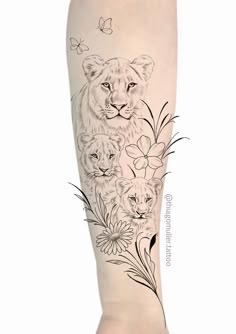 a woman's leg with tattoos on her legs and an image of two lions