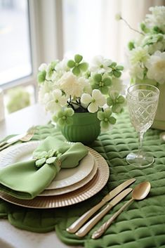 the table is set with green napkins and white flowers