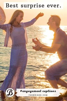 a man kneeling down next to a woman on the beach