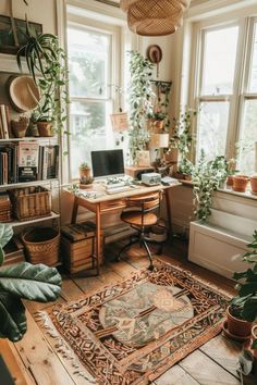 a home office with plants and potted plants on the desk, along with a rug