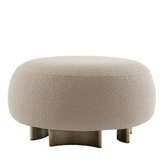 a round ottoman sitting on top of a metal stand