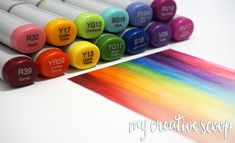 many different colored crayons are next to each other on a table with the word yy9 written in it