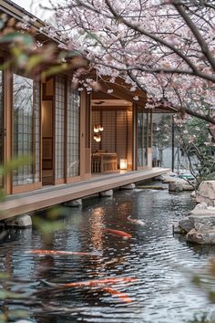 a japanese style house with koi fish in the pond