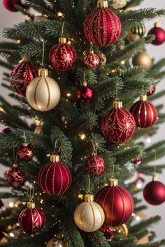 a christmas tree with red and gold ornaments