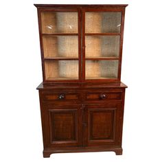 an old wooden china cabinet with glass doors and drawers on the front, against a white background