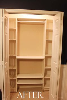 an empty walk in closet with shelves and doors