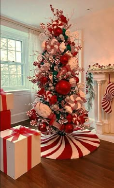 a red and white christmas tree decorated with candy canes