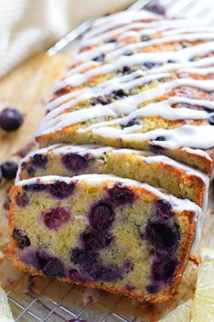 a loaf of lemon blueberry bread on a cooling rack